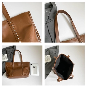Brown vintage rivet tote bag detail showing lychee texture, handles and inner pocket