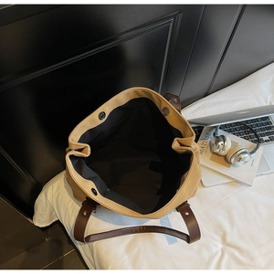Top view of large khaki tote bag with magnetic closure showing spacious interior space