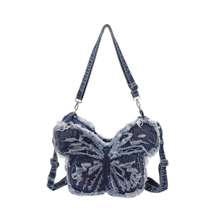 Blue denim butterfly-shaped shoulder bag with red stitching and distressed edges