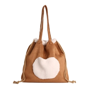 Brown suede tote bag with white fleece heart patch and drawstring closure for women