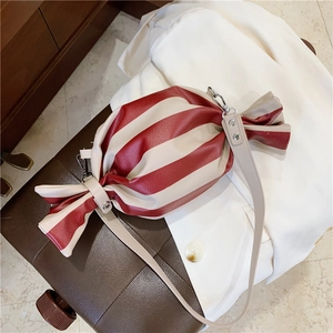 Unique candy-shaped crossbody bag with red and white stripes and silver hardware