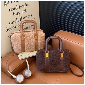 Plush lamb wool handbag with leather trim and gold hardware in two autumn colors