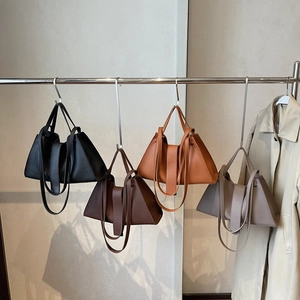 French minimalist leather tote bags in four colors with draped textured pleats