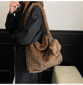 Detailed close-up of brown plush tote bag with grid texture and matching mini pouch