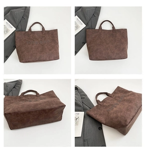 Detail view of large dark brown retro tote bag showing front, back and side textures