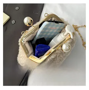 Interior view of fuzzy shell bag showing storage space for phone and cosmetics