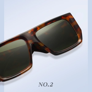 Close-up of retro tortoise shell texture and dark lenses on square fashion sunglasses