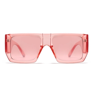 Detail of pink transparent square sunglasses with a wide frame and ergonomic temple