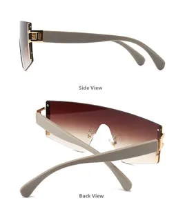 Detailansicht der braunen randlosen Sonnenbrille mit Goldmetallscharnieren und Akzenten