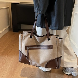 Retro canvas tote bag with brown leather trim and hand-stitched detailing