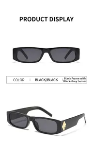 Detail of vintage narrow rectangular black sunglasses with gold diamond temple accents