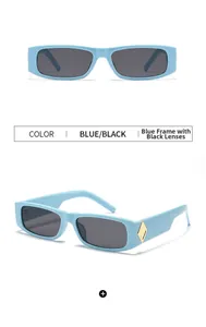 Detail of vintage narrow rectangular blue frames with grey lenses and gold metal accents