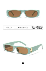 Detail of mint green rectangular sunglasses with tea lenses and gold diamond accents