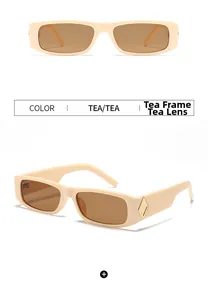 Detail view of retro rectangle cream sunglasses with tea lenses and golden metal accents