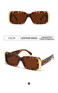 Détails de lunettes rectangulaires imprimé léopard avec verres thé et accents dorés