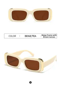 Détail de lunettes de soleil rectangulaires beige avec verres thé et accents dorés