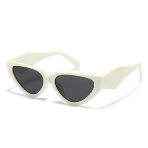 Trendy cat-eye sunglasses with thick white frame and dark lenses for women street fashion