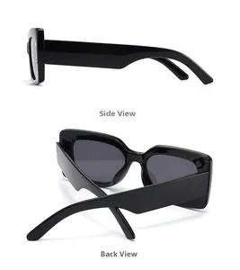 Detail view of bold thick frames and dark lenses on modern polygon sunglasses