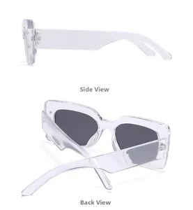 Detail view of transparent sunglasses featuring gold star rivets and gray lenses