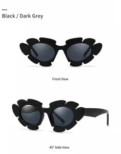Detail of flower shaped oversized sunglasses with black matte frames and dark blue lenses