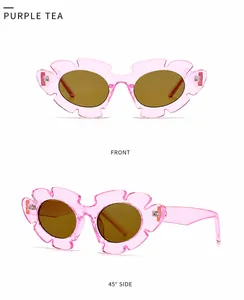 Close-up of pink flower-shaped sunglasses with brown lenses from front and side angles