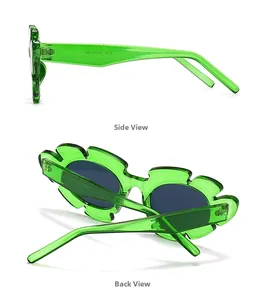 Detail view of flower shaped green sunglasses showing the translucent frame and grey lenses