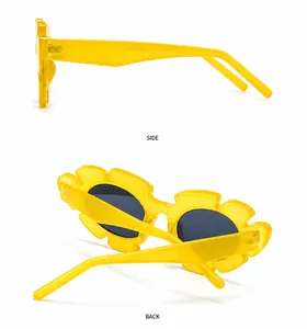 Detail of yellow flower-shaped sunglasses with dark lenses from multiple angles