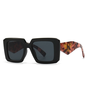 Modern baroque square sunglasses with black frames and tortoiseshell wide leopard temples