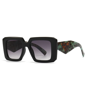 Baroque style rectangular sunglasses with black frame and marble textured temples