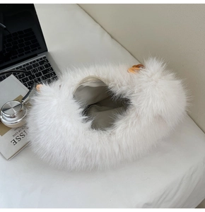 Top view of white plush faux fur bag showing fabric lining and zipper closure