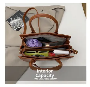 Internal view of brown PU leather tote bag with compartments for essentials