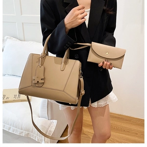 Detail of khaki PU leather handbag set with geometric stitching and matching pouch