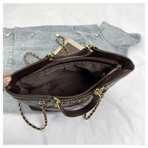 Top view of large dark brown quilted tote bag with chain strap and inner zipper pocket