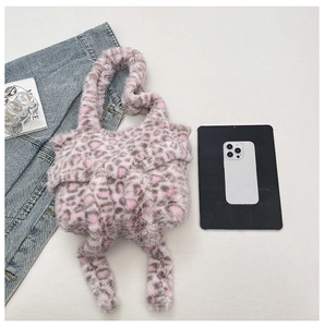 Close-up of pink leopard print plush shoulder bag with high-quality faux fur texture