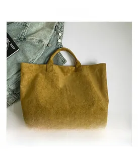 Macro shot of ginger faux suede texture and white Tote Bag lettering detail