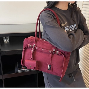 Burgundy faux suede bowling bag with silver grommets and a mini matching coin purse
