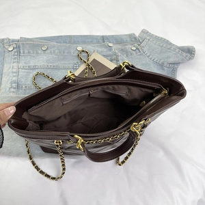 Dark brown quilted tote bag with large capacity and gold metal chain handles