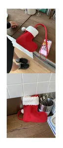 Detail of Christmas stocking crossbody bag in red velvet with white faux fur and pompom
