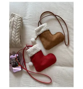 Detailed view of plush sheepskin-style Christmas stocking bags with leather straps
