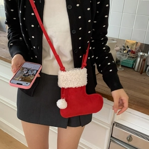 Christmas stocking shaped crossbody bag in red suede with white faux fur trim and strap