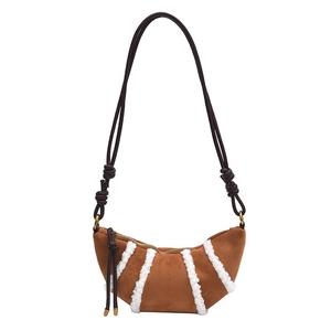 Brown sherpa striped faux suede crescent bag with knot detail and zipper strap
