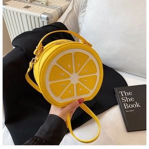 Creative lemon shaped handbag in bright yellow PU leather with gold tone hardware