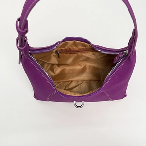 Top view of purple hobo bag showing silver zipper, satin lining, and inner pocket