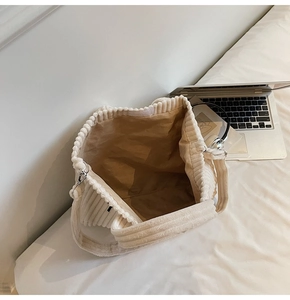 Large beige corduroy tote bag showing spacious interior and soft fabric lining