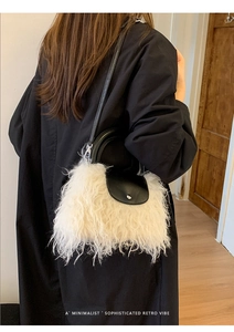 Minimalist black and white faux fur bag with retro leather handle and metal buckle