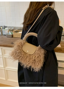 Close-up of plush faux fur handbag with leather handle worn by a model in a retro setting