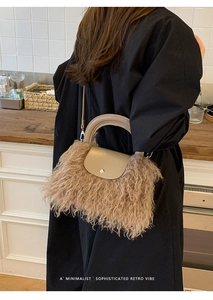 Detail of khaki plush handbag with faux fur texture and elegant retro leather handle