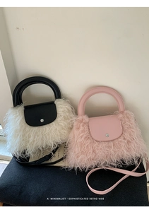 Detail of plush faux fur handbags with metal buckles and elegant contrast textures