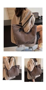 Close-up of brown corduroy tote bag with black leather straps in casual urban style