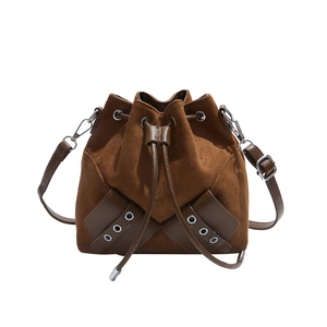 Vintage brown suede bucket bag with drawstring closure and adjustable leather shoulder strap